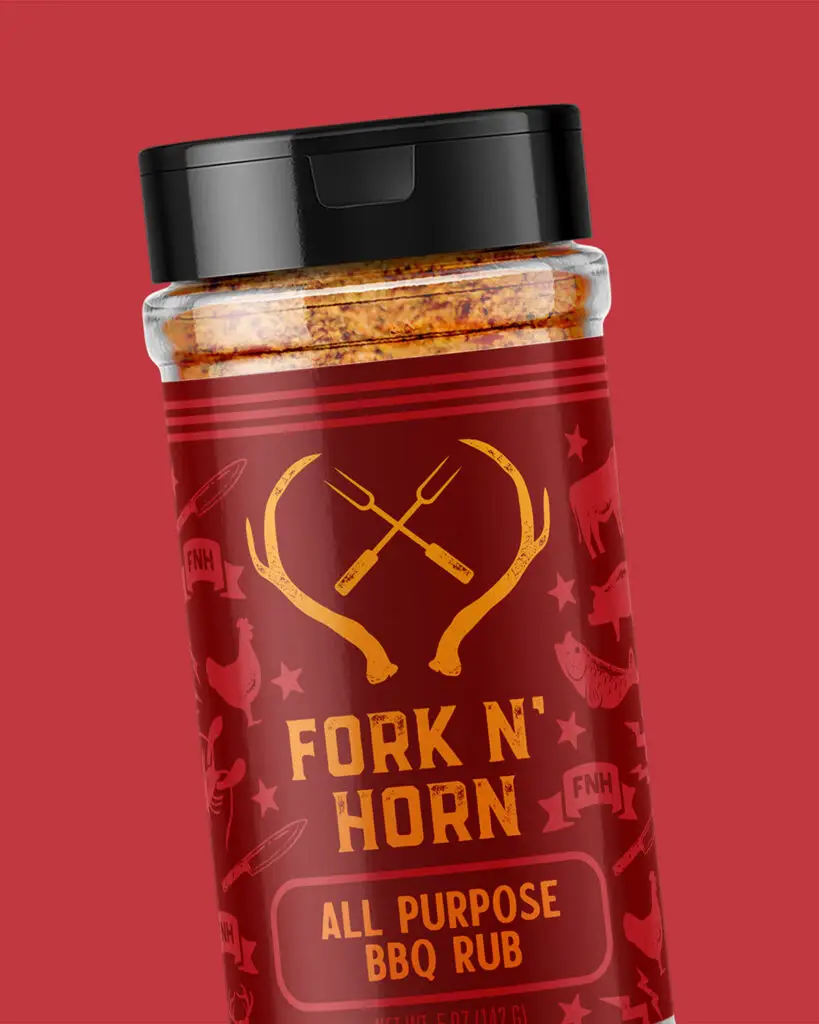 A 5oz shaker of Fork N' Horn All Purpose BBQ Rub featuring orange text and designs on a dark red background.