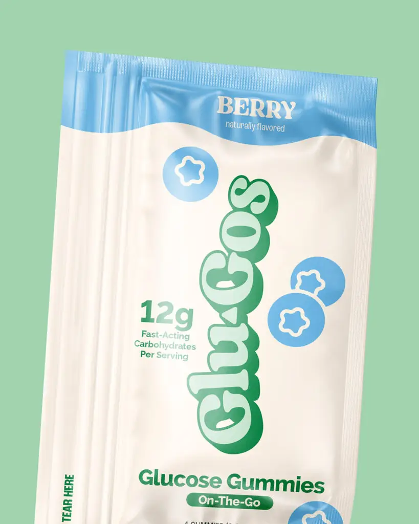 A pouch of Glu-Gos Glucose Gummies, with green text and blue designs on a tan background. Apple Of My Chai flavored marshmallows, by The Magical Mallow, with purple and green text on a dark green, light green, and tan background.