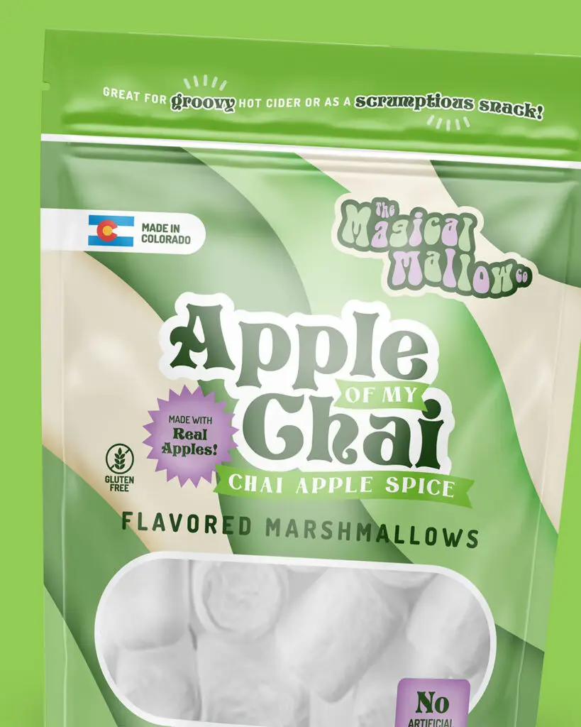A pouch of Apple Of My Chai flavored marshmallows, by The Magical Mallow, with purple and green text on a dark green, light green, and tan background.