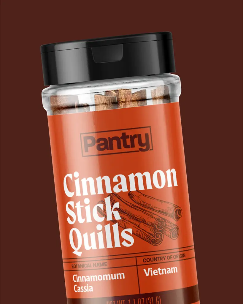 A shaker of Pantry's Cinnamon Stick Quills, featuring white and brown text on a red-orange background.