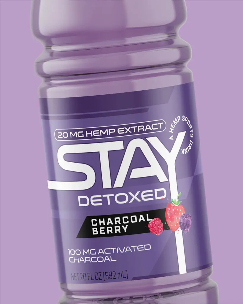 A bottle of Stay Detoxed Charcoal Berry sports drink, with the product and company info in white text on a purple background.
